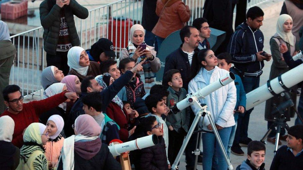 a gathering of children in Syria looking for the New Moon