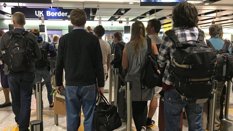 Passengers queuing at airport