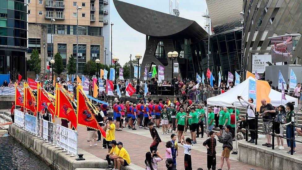 participants line up outside the Lowry Theatre