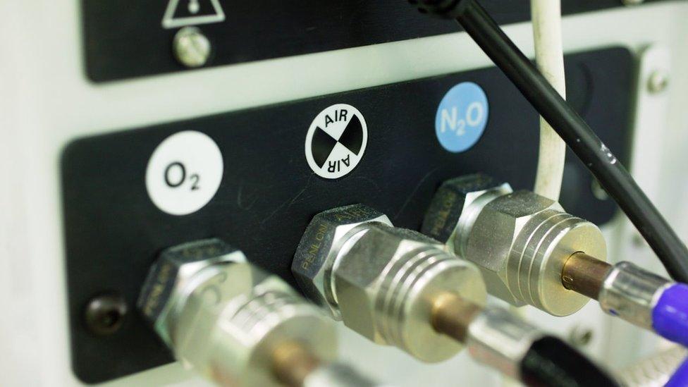 Close up of 02 (Oxygen), air and N2O (Nitrous Oxide) outputs on anaesthetic machine.