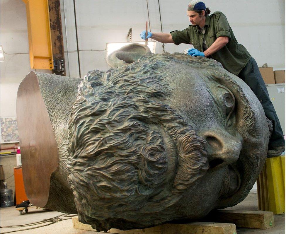 Matthew Dunn waxes Douglas Coupland's bronze sculpture "Vincent van Gogh"