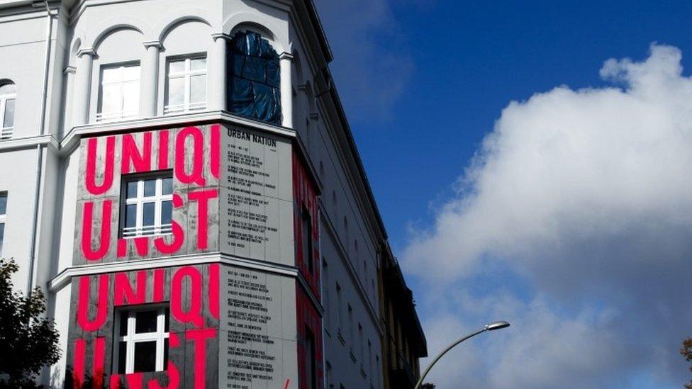 Pink coloured letters are painted at the wall at the Museum for Urban Contemporary Art in Berlin (15 September 2017)