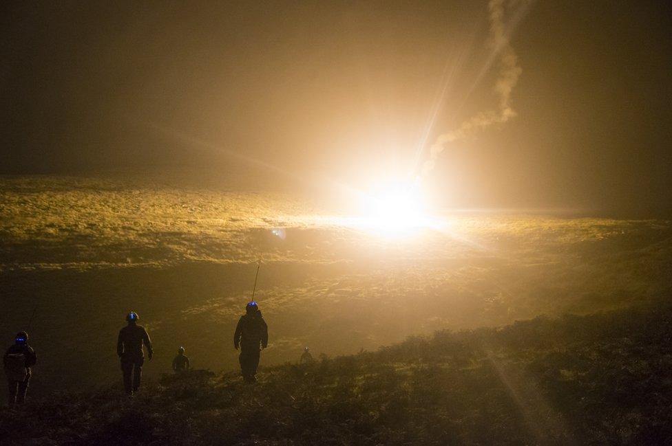 Members of 15 Squadron RAF Regiment move across the hills during a training exercise at Dartmoor Training Area