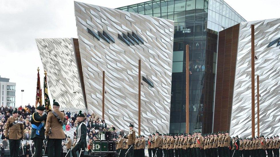 ceremony with titanic buildings in background