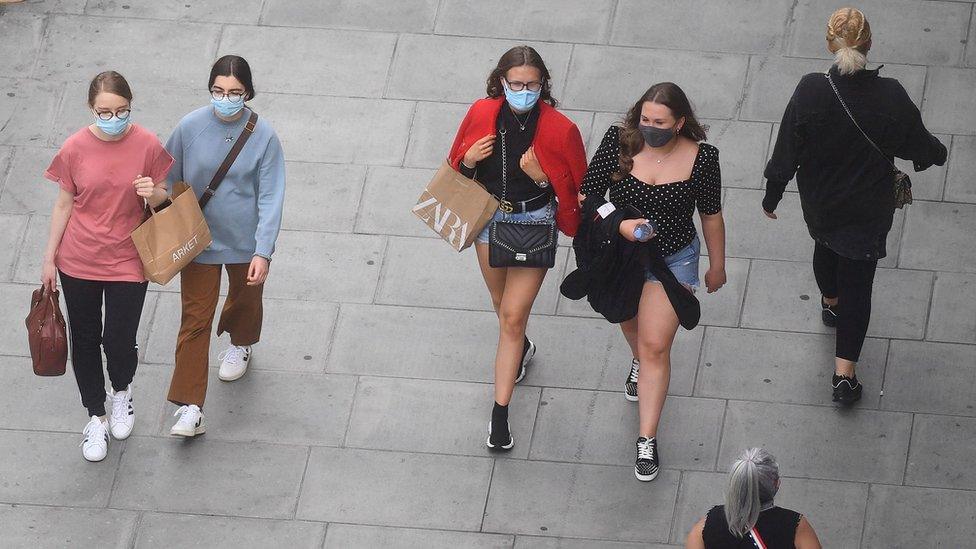 Shoppers in face masks on Oxford Street