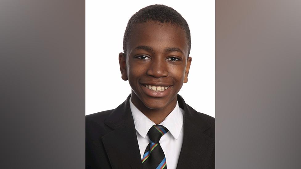 Portrait of Isaac Uzoegbu in school uniform