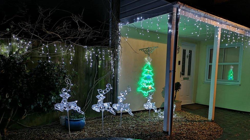 Christmas lights on the front of a house.