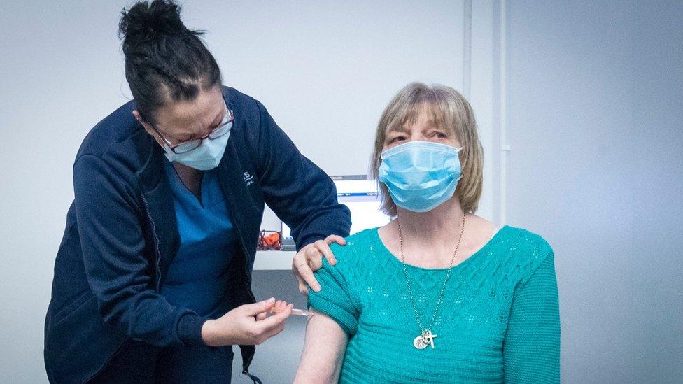 woman being vaccinated