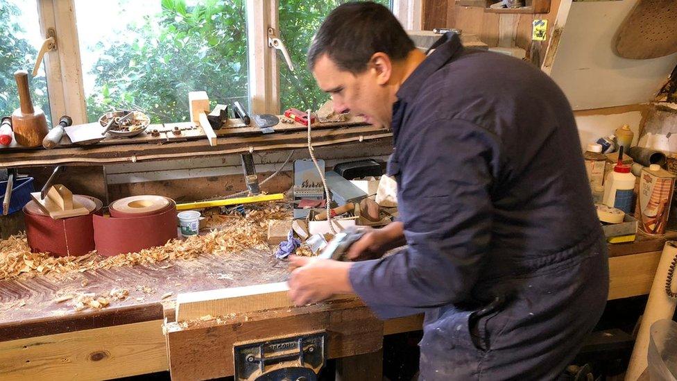 Stephen Sowerby working on the classic car parts