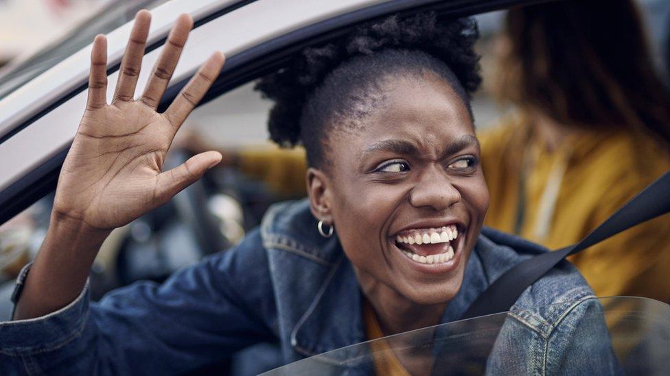 Woman waving