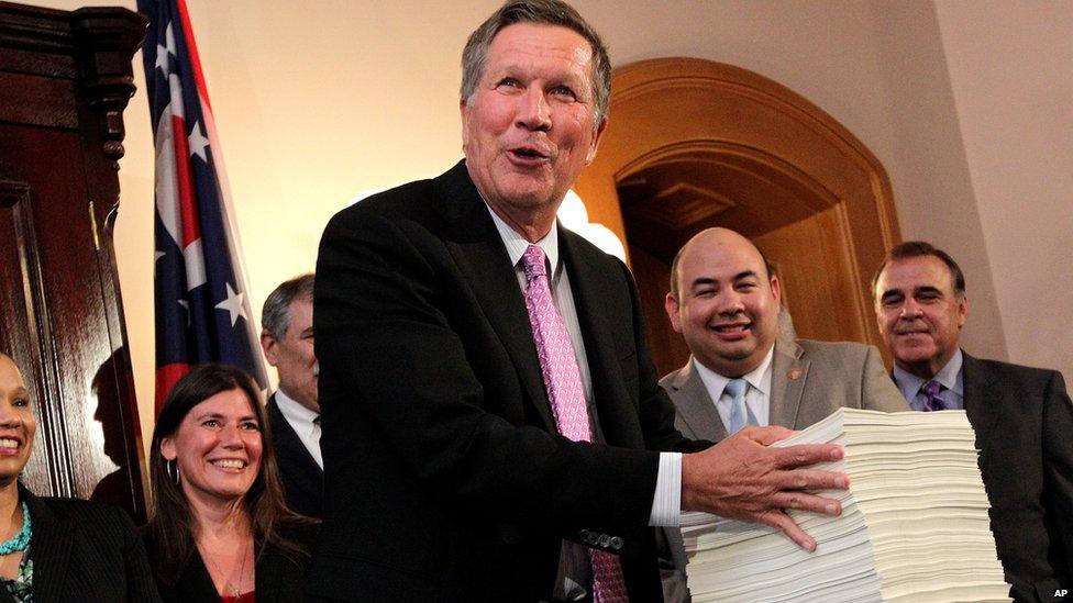 Ohio Gov. John Kasich presents Ohio"s 2016-2017 operating budget after signing it Tuesday, June 30, 2015, in Columbus, Ohio.