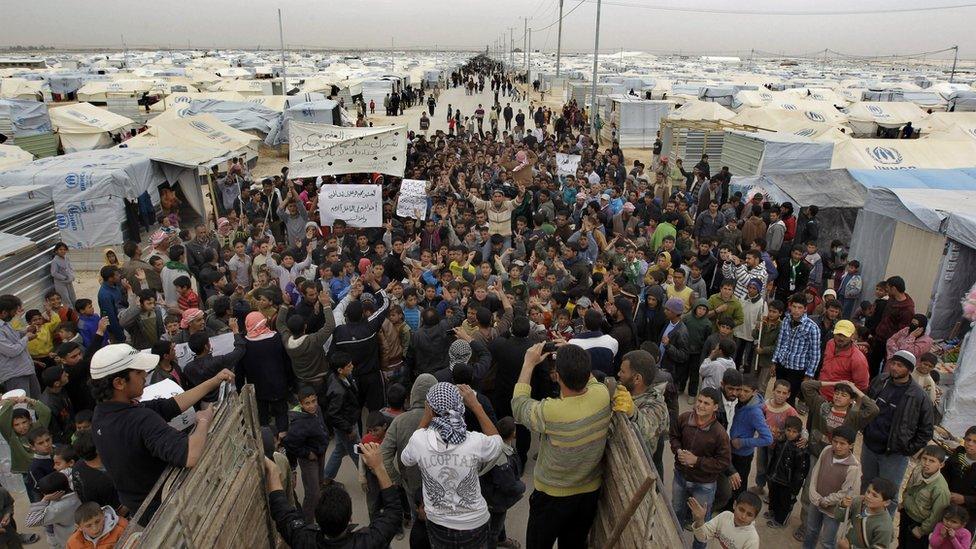 Syrian refugees take part in a demonstration at the Zaatari refugee camp, near the border with Syria, calling for the international community to arm the rebel Free Syrian Army on February 22, 2013. Jordan says it is hosting around 380,000 Syrian refugees, including some 83,000 in Zaatari, which has seen frequent protests, mainly over poor living condition