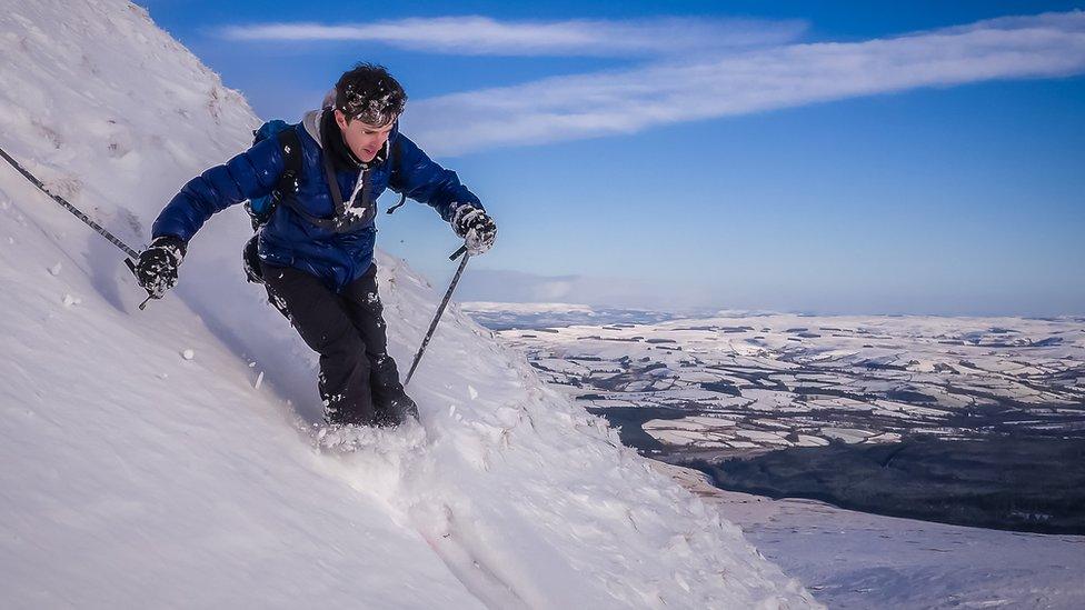 Chris skiing in some deep snow