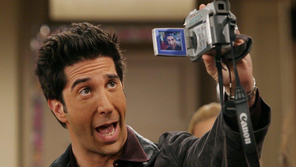 David Schwimmer as Ross pulls a face at a Camcorder