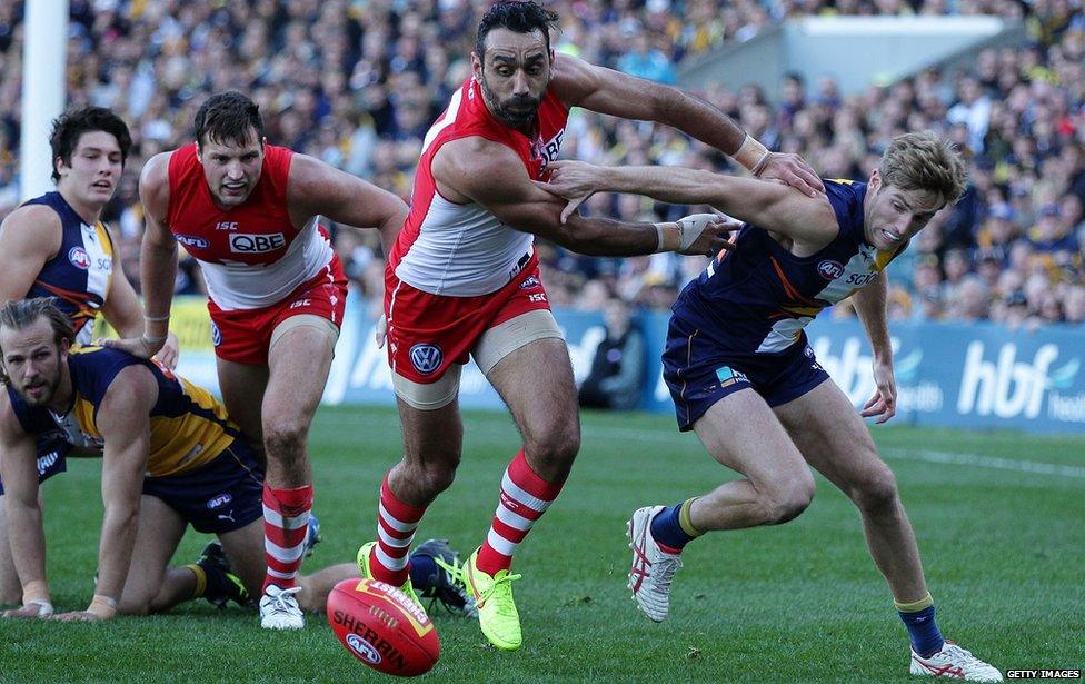 Adam Goodes of the Swans pushes other players at Domain Stadium on 26 July, 2015