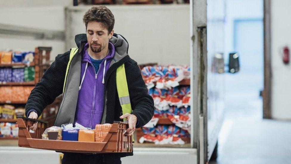 man-with-supermarket-items.