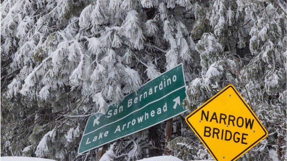 Road signs buried in snow