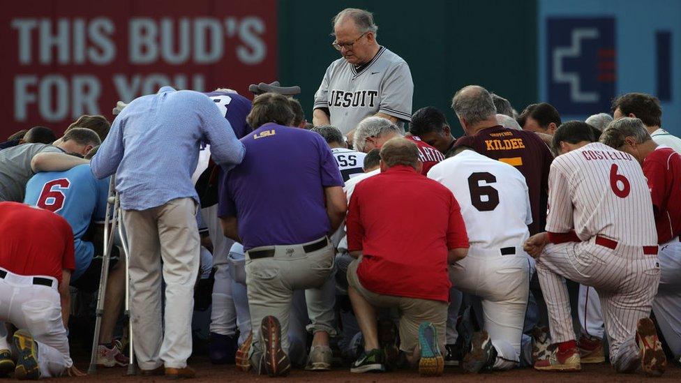 Fr Conroy (centre) led a prayer one day after a shooting at a congressional softball practice