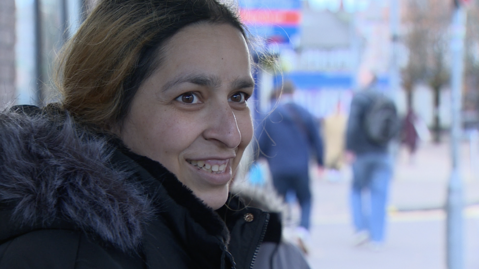 Saira Khan waiting for the bus