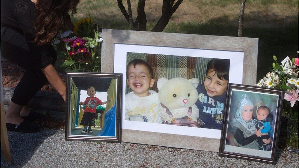 Photographs of late brothers Alan and Ghalib Kurdi and their mother displayed outside the home of their aunt Tima Kurdi, in Coquitlam, British Columbia, on 4 September 2015