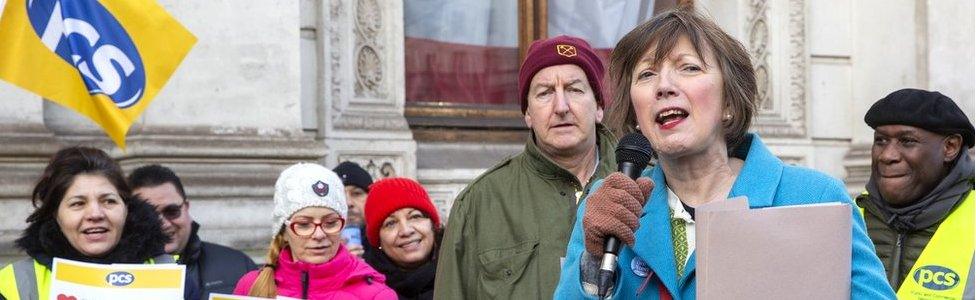 Frances O'Grady speaking into a microphone at a picket line