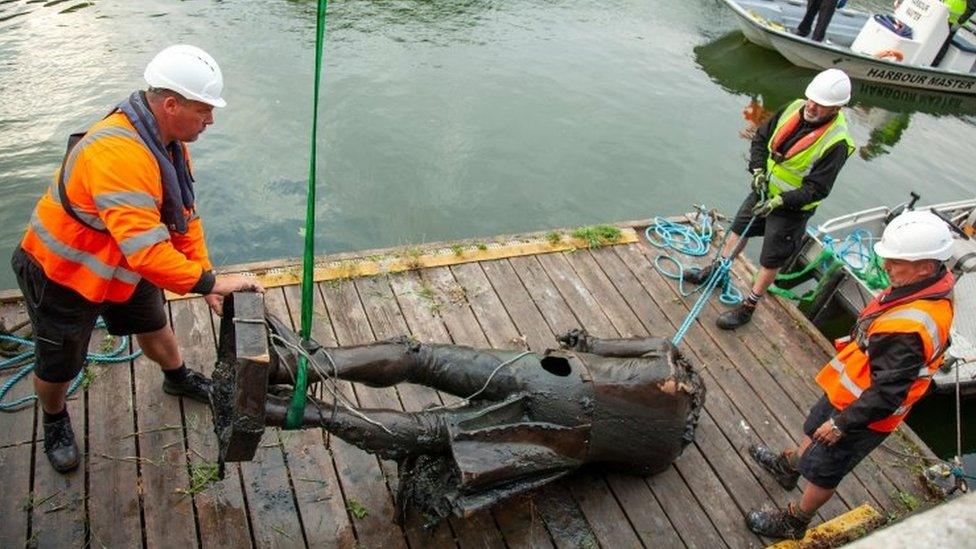 The statue of Edward Colston being retrieved from the harbour in Bristol, southwest England