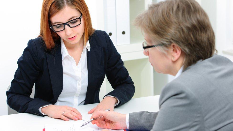 Young women talking to her boss about her health