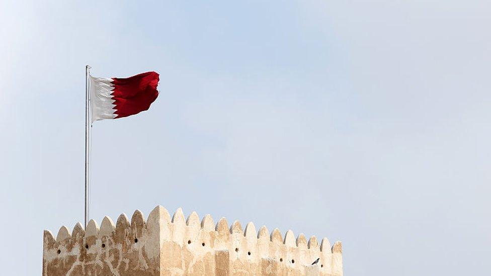 A Qatari flag flying over a Qatari fort 2016