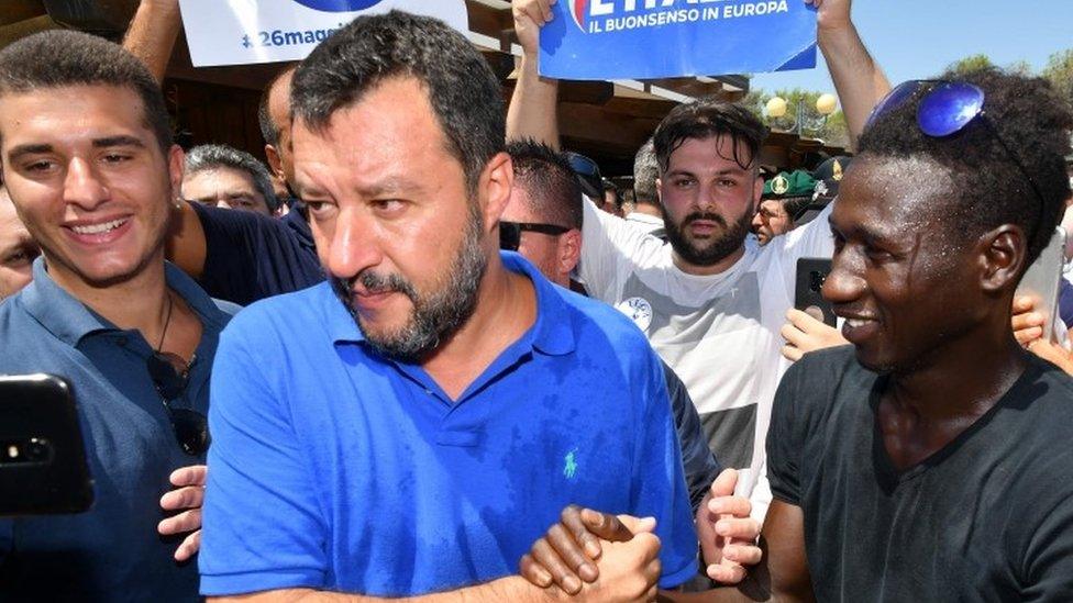 Matteo Salvini shakes hands with a supporter during his electoral tour "Italian Summer Tour" in Policoro on August 10