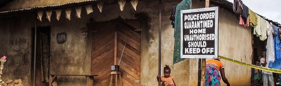 Signboard reading "Police order quarantined home unauthorised should keep off" in Sierra Leone