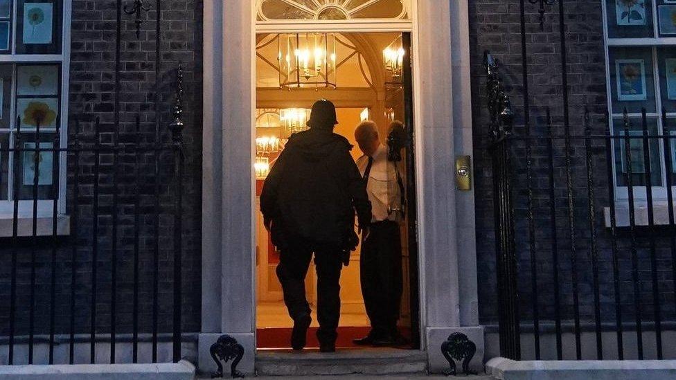 Police officer entering No 10