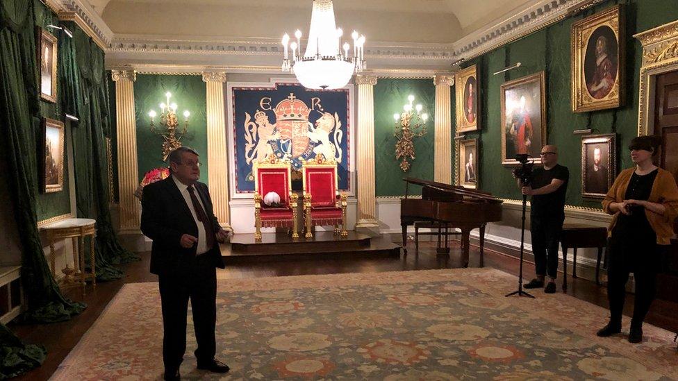 Denis Murray talking inside Hillsborough Castle