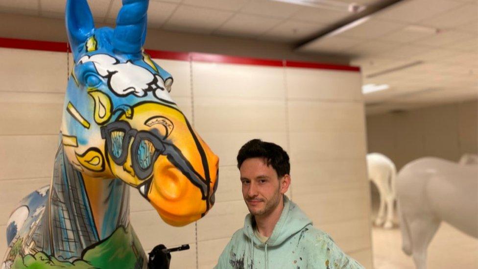 A unicorn being painted in Bristol's Broadmead shopping centre