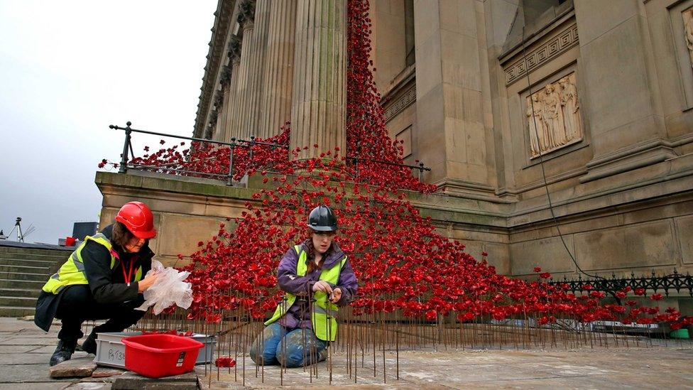 Two women working at the installation at St George's Hall