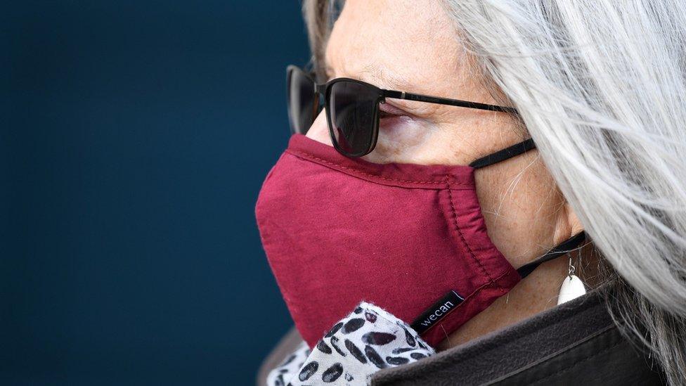 Woman in London wearing face mask, 2 March