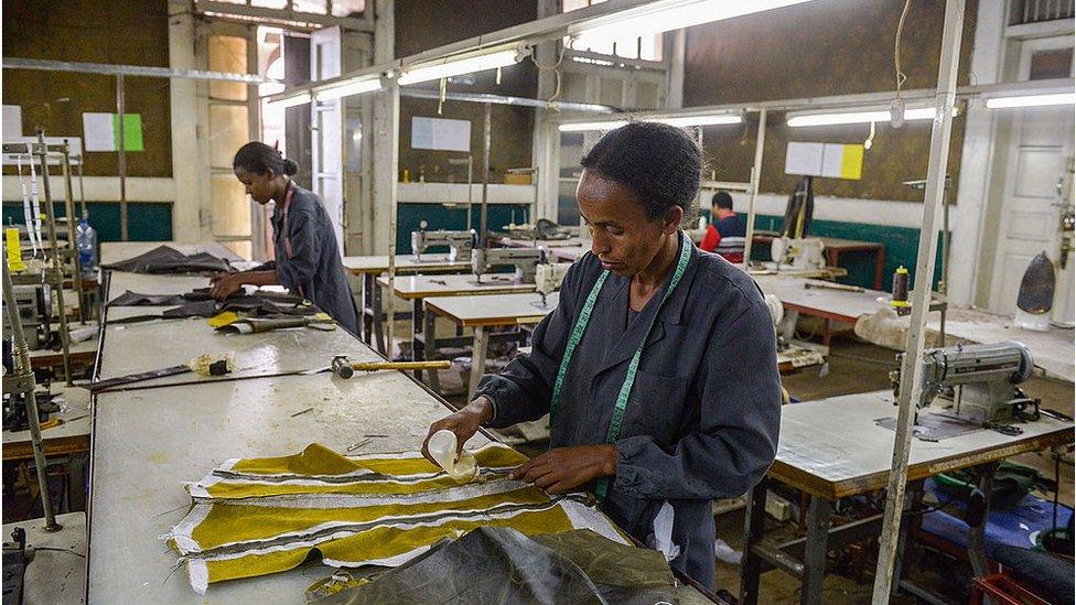 Women make clothes in a textile factory in Ethiopia