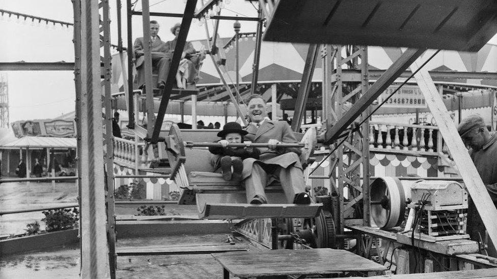 Man and child on Ferris wheel