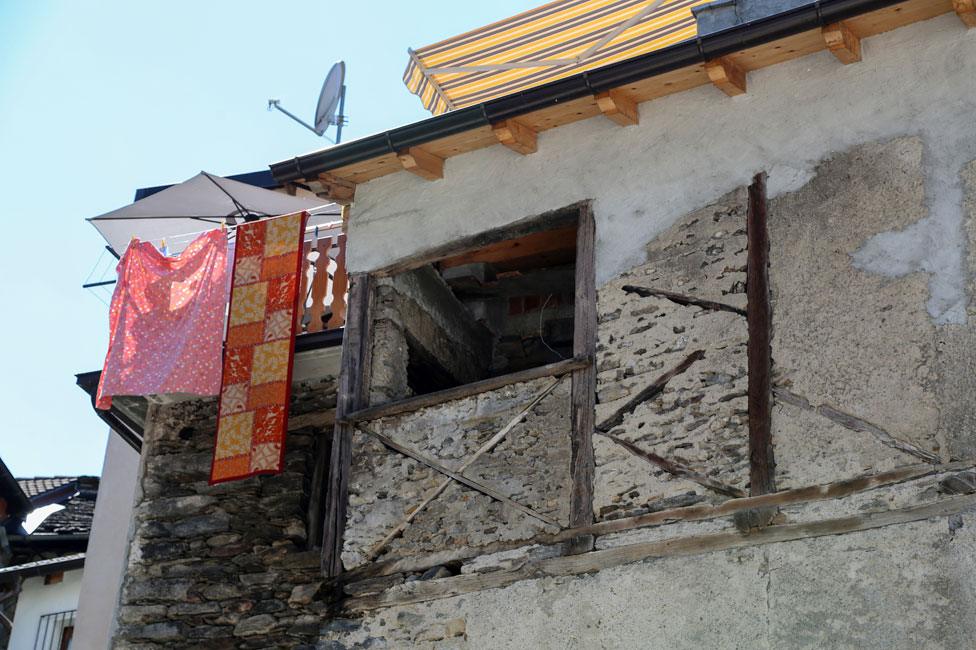 Wooden cross under a window