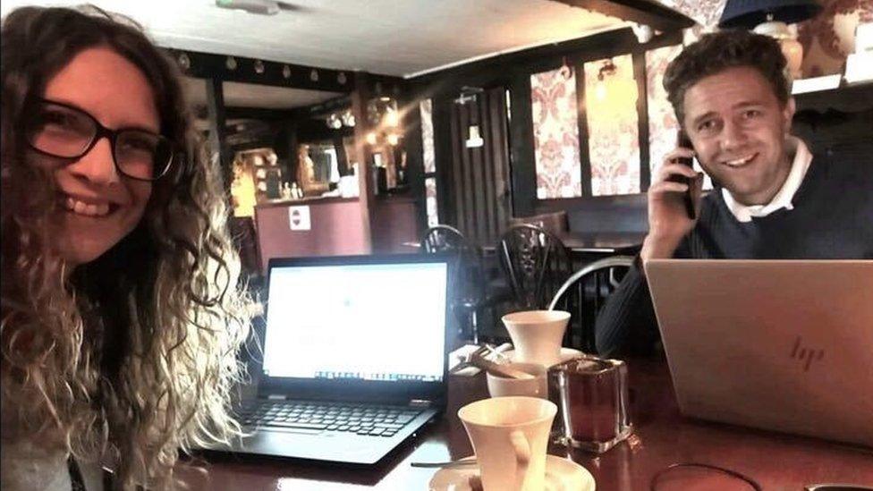 Natalie Phillips and her husband at a "pub desk"