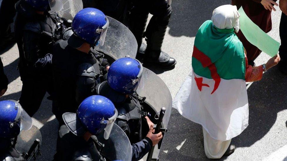 Algerian demonstrators take part in an anti-government demonstration in the capital Algiers on March 16, 2021