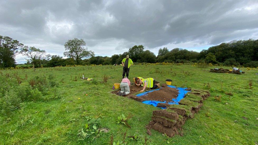 Volunteers excavating site