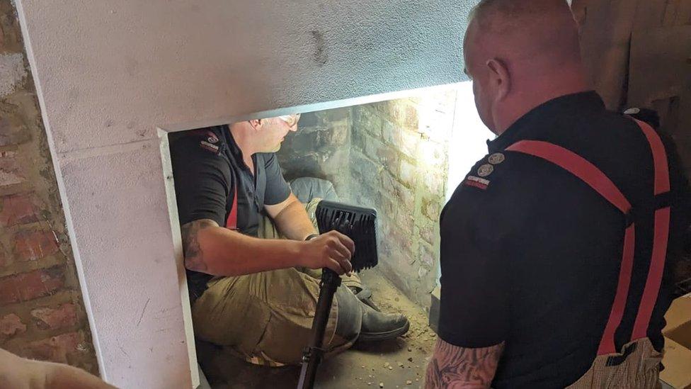 Fire fighter working in a fireplace