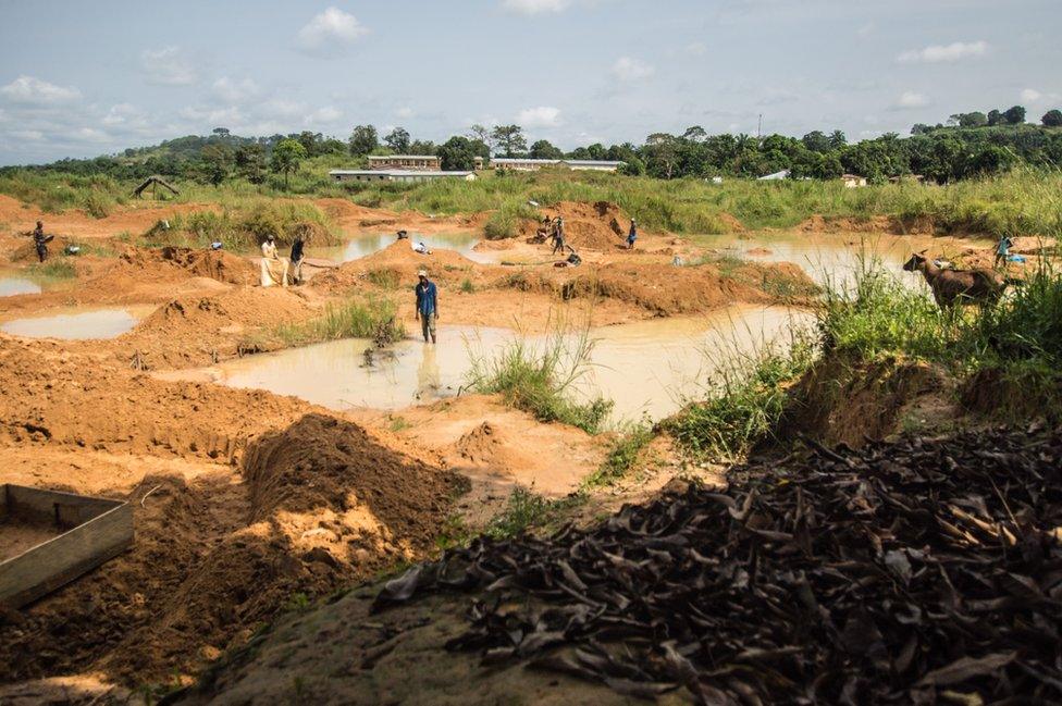 The landscape is full of holes and piles of mud