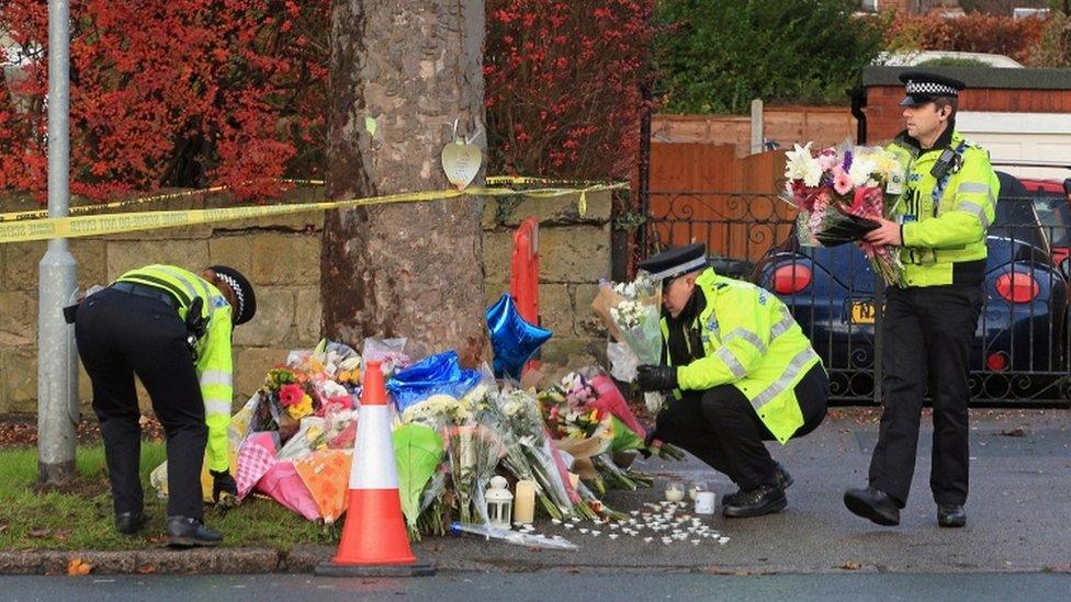 Police laying flowers