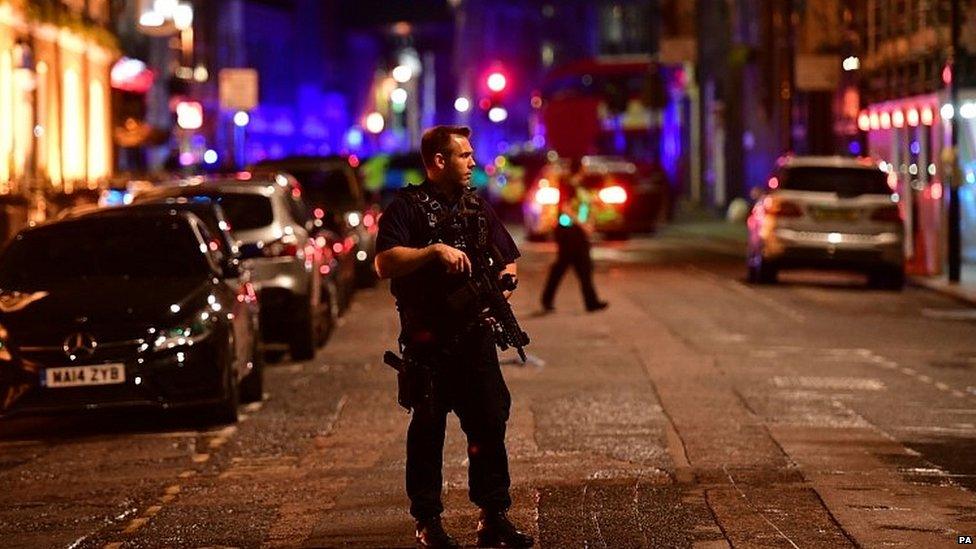 Armed police officer in central London