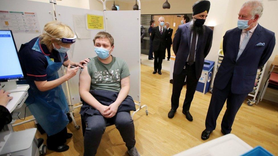 The Prince of Wales (right) talks with Chief Pharmacist Inderjit Singh during a visit to the Queen Elizabeth Hospital in Birmingham to thank volunteers