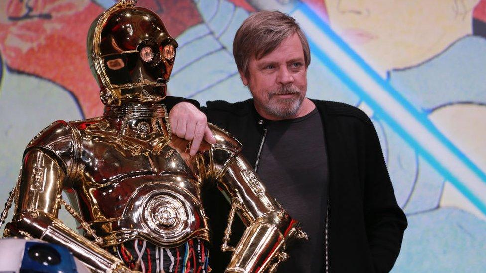 Actor Mark Hamill poses with C-3PO at Star Wars Premier for The Last Jedi