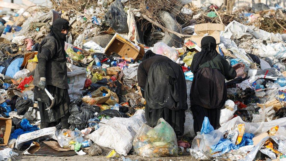 Iraqi women search for recyclable items at a rubbish dump in Baghdad, Iraq (6 May 2020)