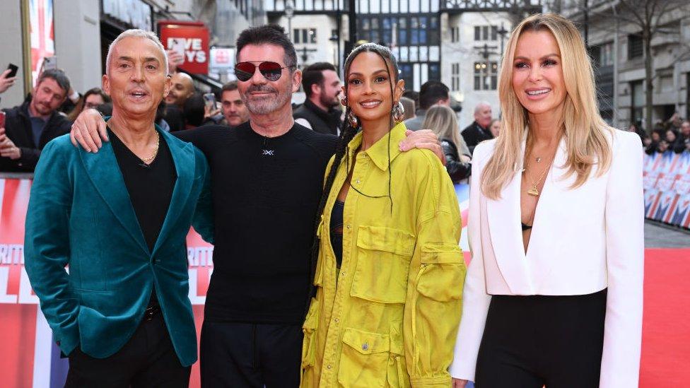 simon cowell standing with bgt judges