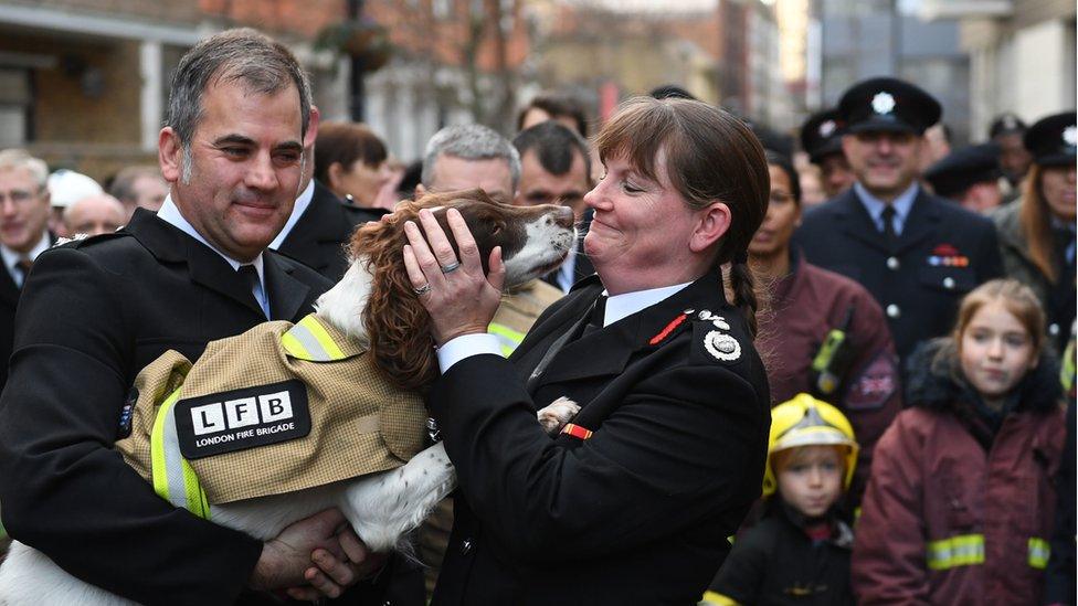 Dany Cotton hugging a LFB dog